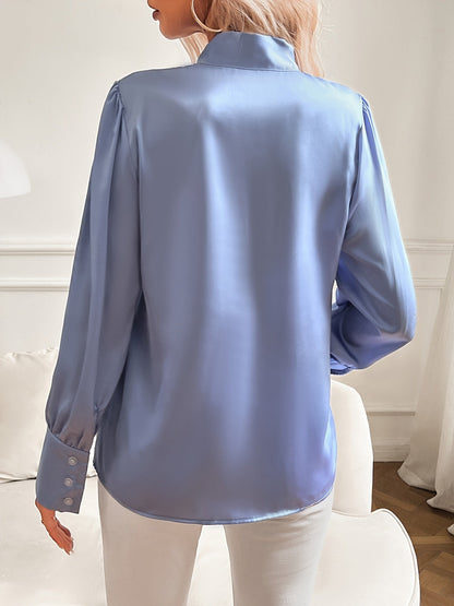 Damebluse med satin look sløjfe i halsen og lange ærmer